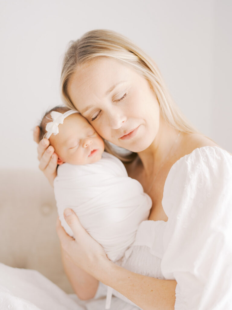 mother and daughter during studio newborn session in Dallas
