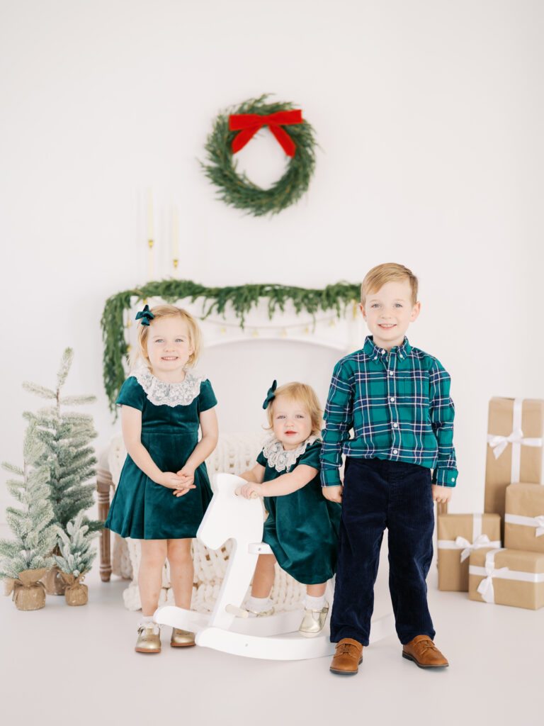 three kids together during holiday family session 