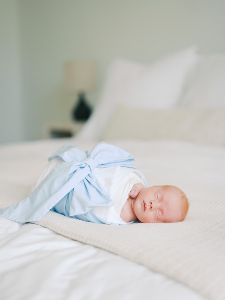 baby boy swaddle in bed