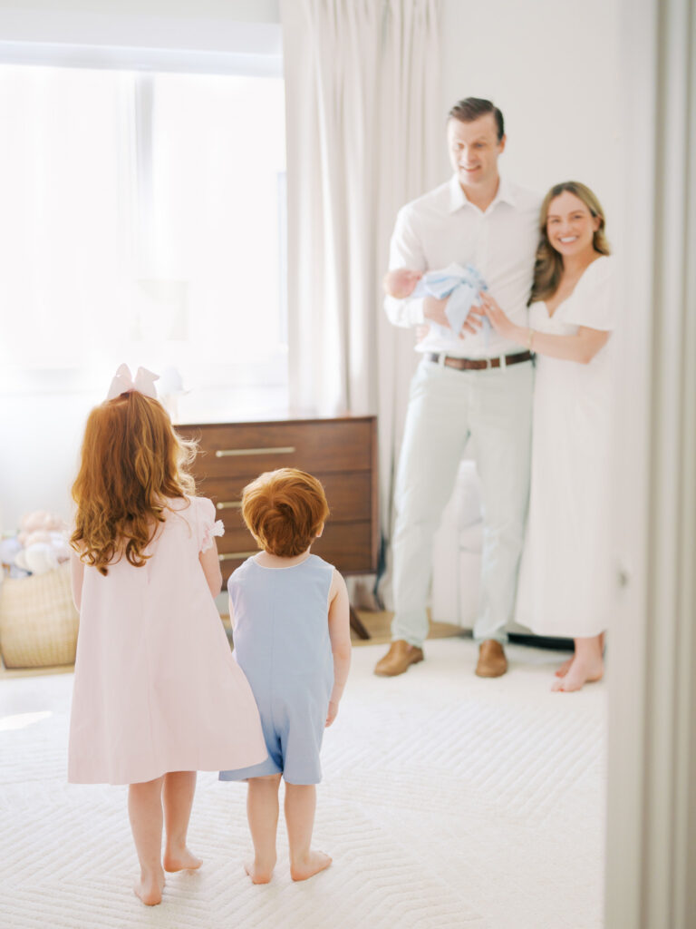 parents looking at kids during family session