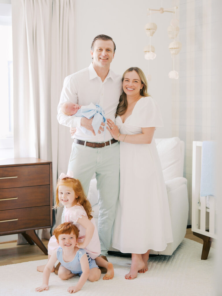 happy family of five smiling