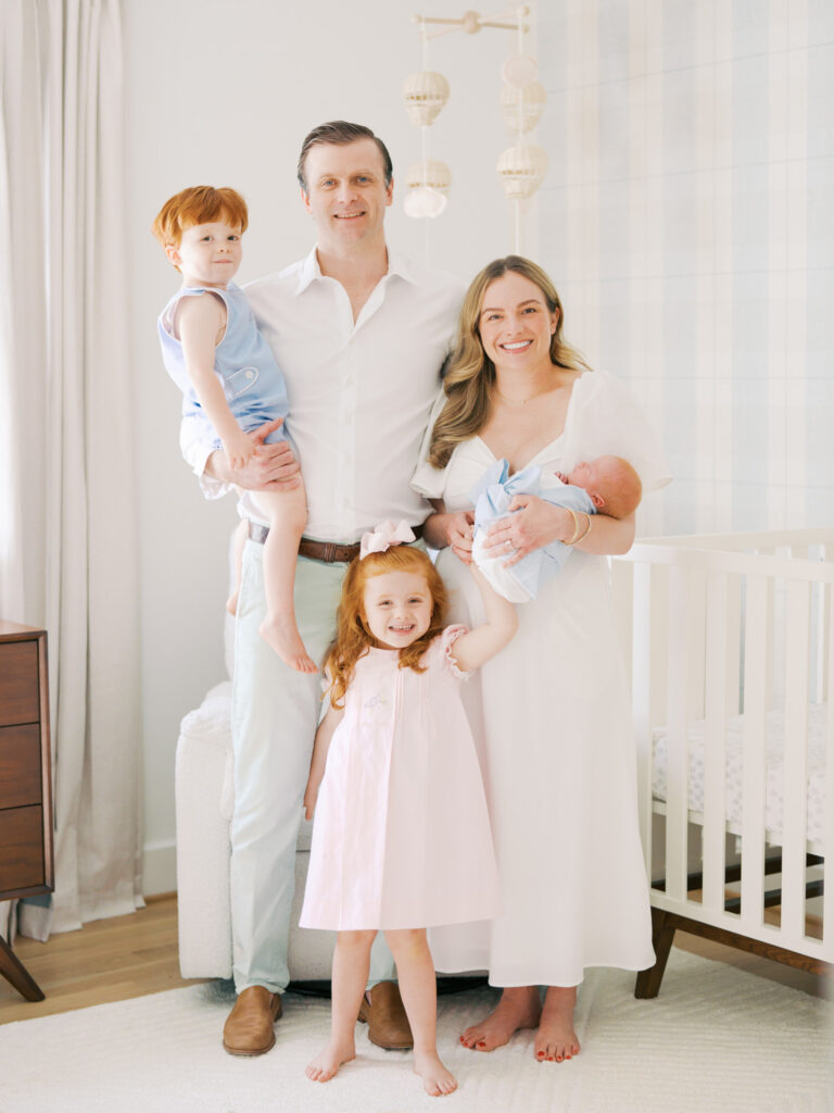 Family of five during their in home newborn session in Dallas