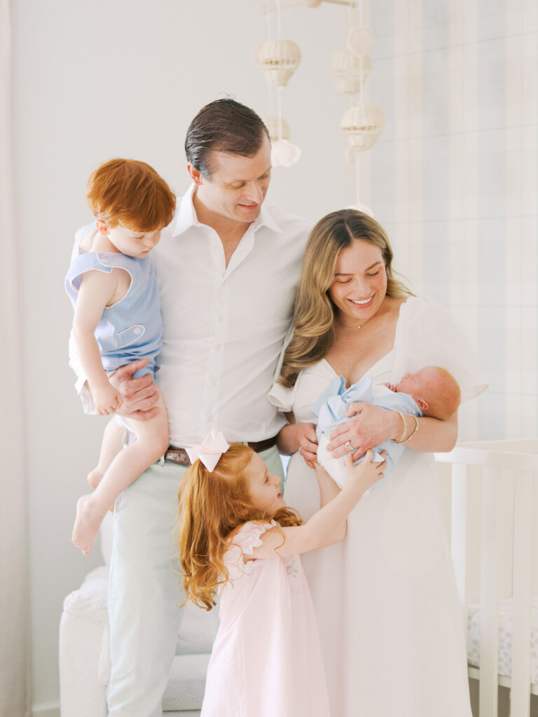 family looking at little brother