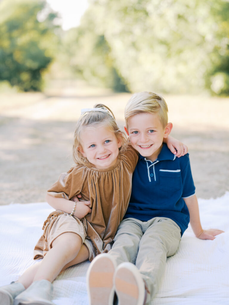 brother and sister smiling