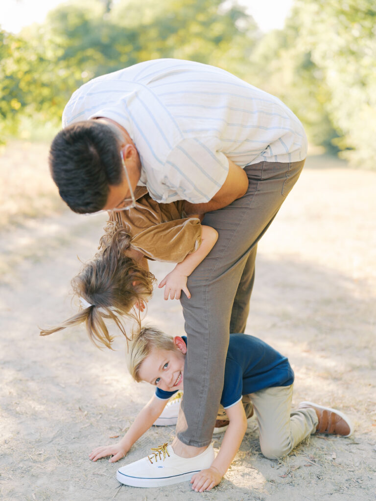 dad playing with kids during dallas family session
