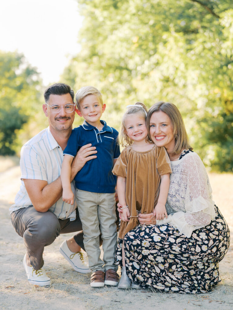 family of four smiling