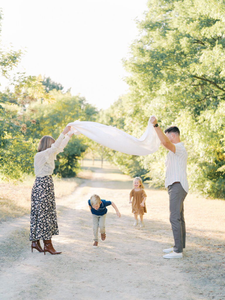 family playing london bridge during their dallas spring family session